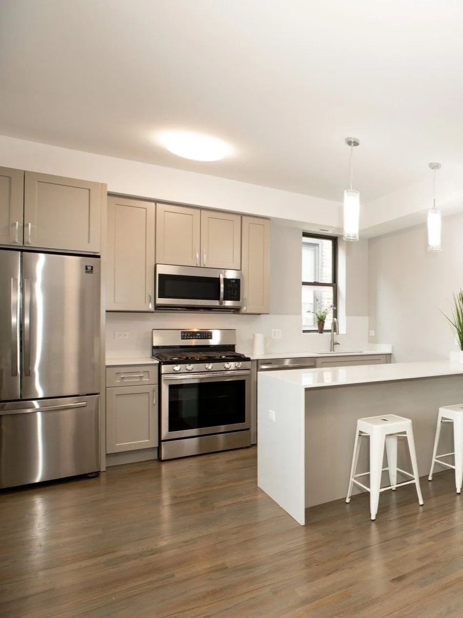 A renovated kitchen with stainless appliances